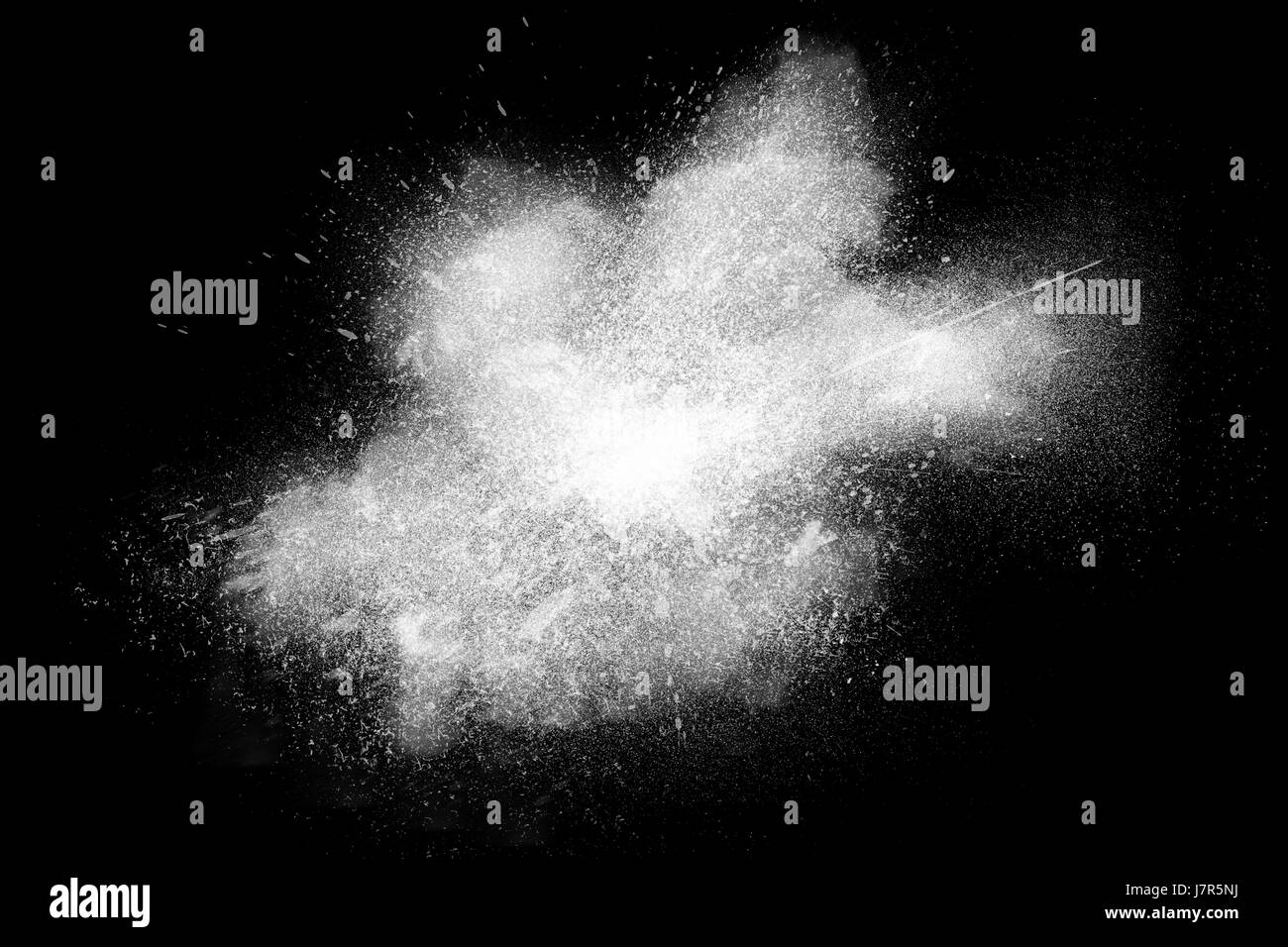 Freeze motion of white powder exploding, isolated on black, dark ...