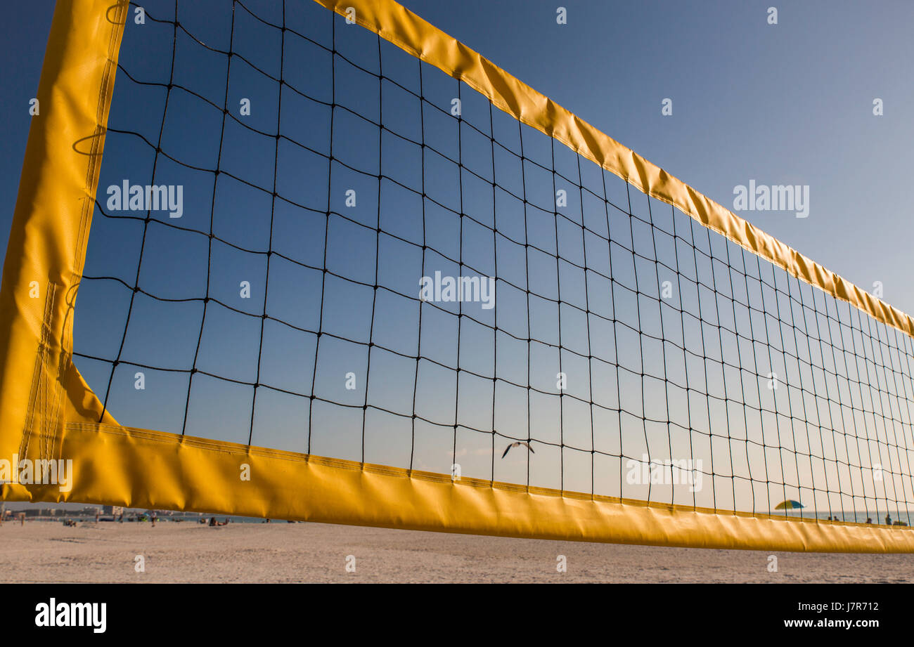 Closeup volleyball net against a blue sky on a beach in Florida Stock Photo