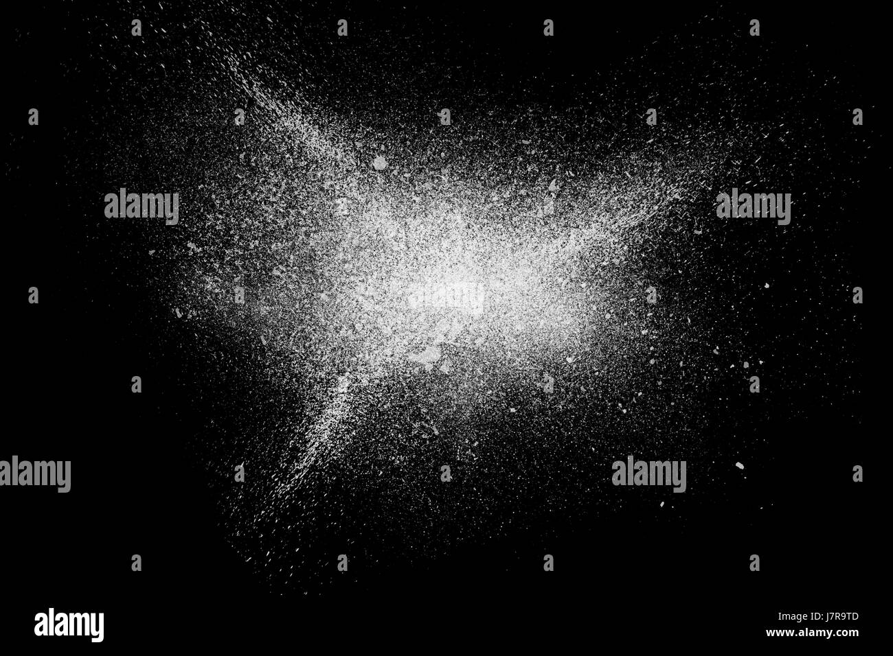 Freeze motion of white powder exploding, isolated on black, dark ...