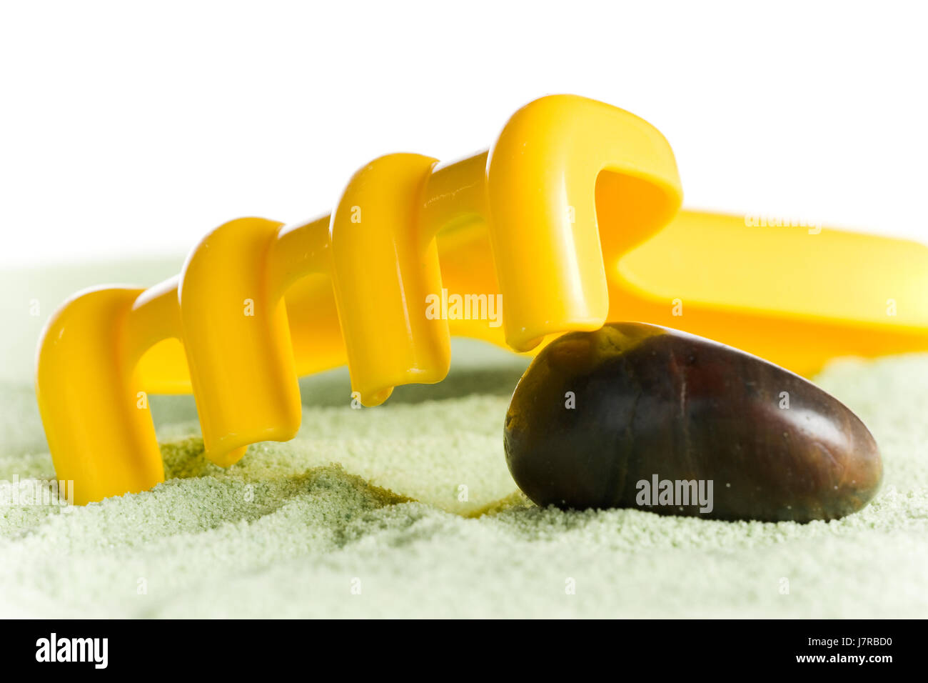yellow toy rake Stock Photo - Alamy