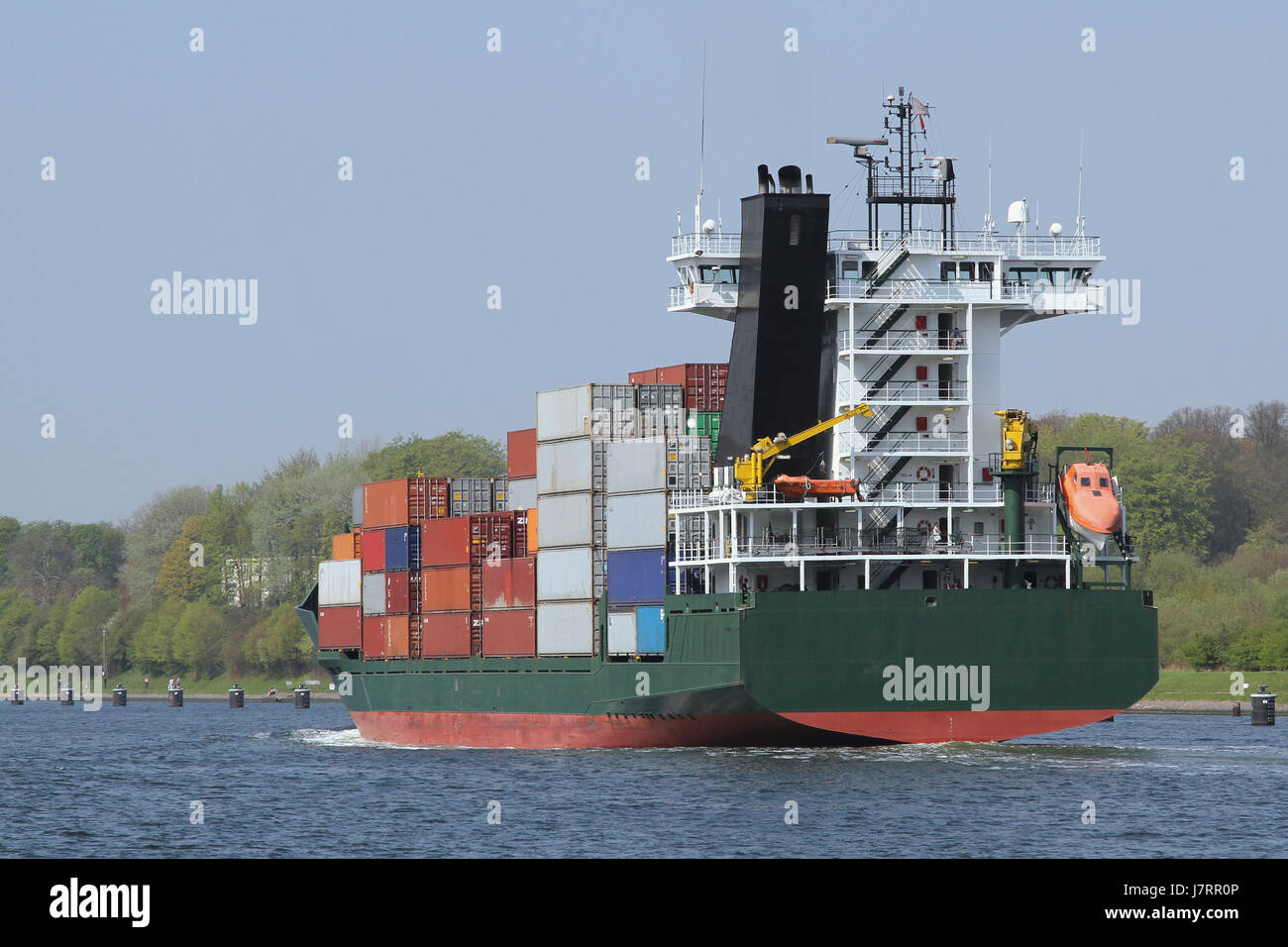 feeder ship with containers Stock Photo