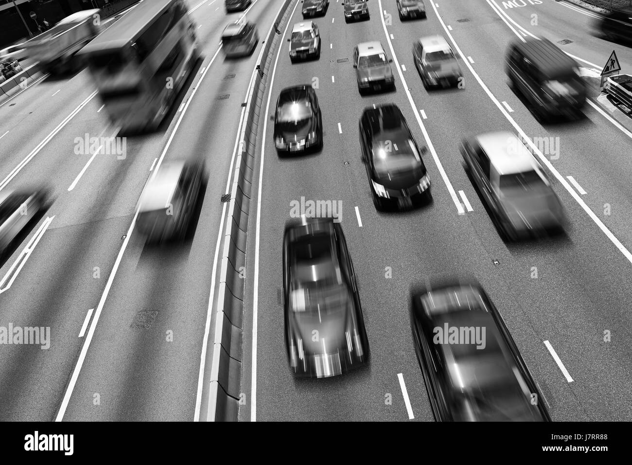 Traffic on multiple lane highway with motion blur (Black and White) Stock Photo