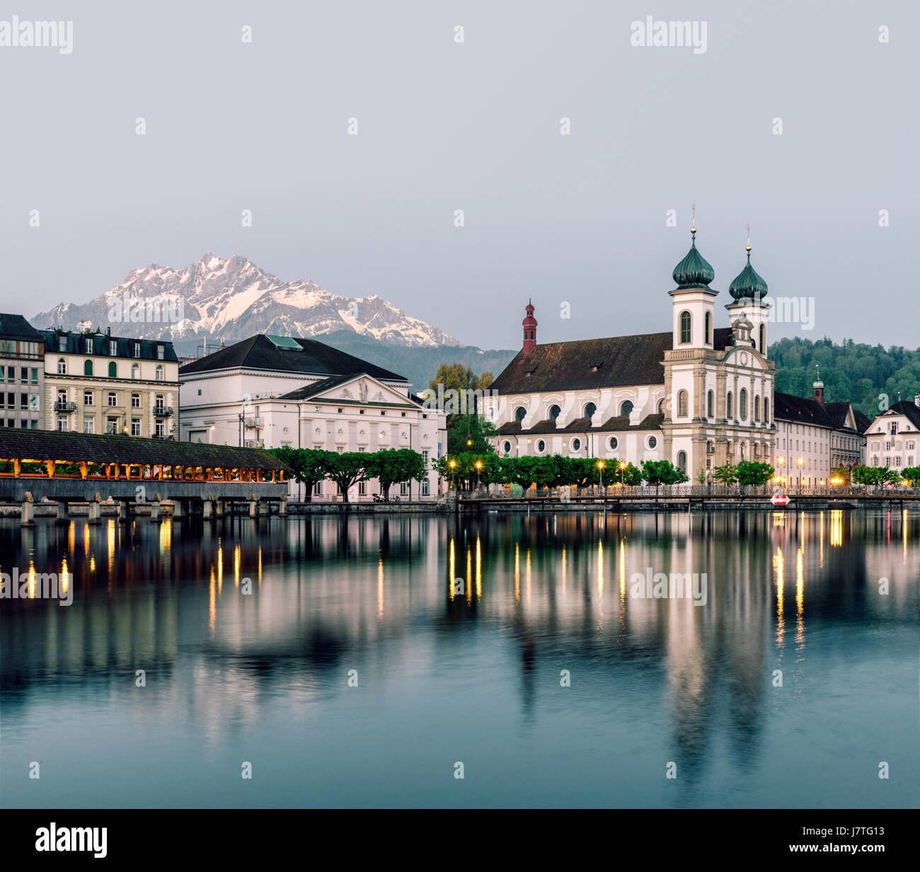 Blue hour in Lucerne, Switzerland with a view of the Swiss Alps and Stock Photo
