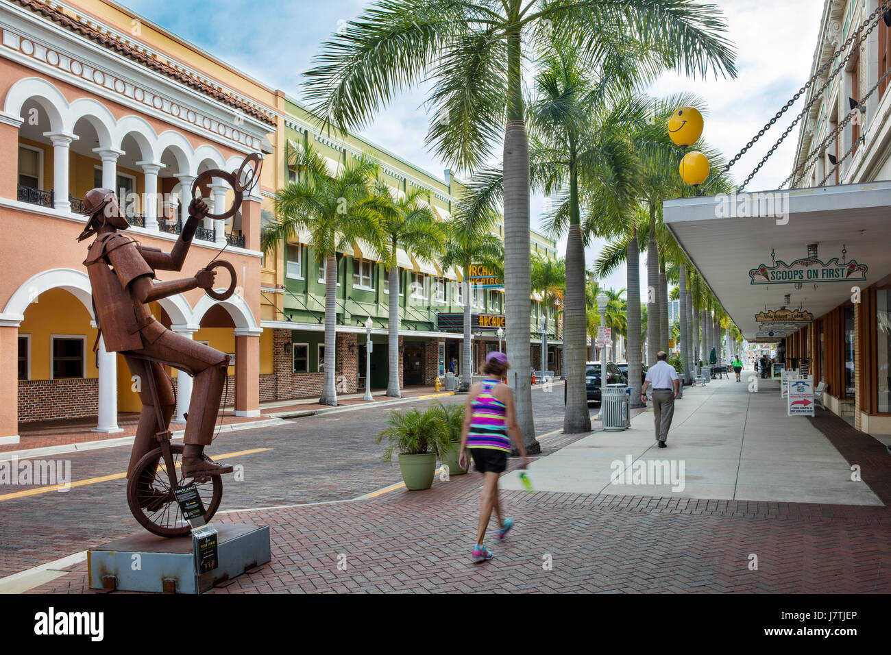 Juggler on a Unicycle - a metal sculpture by Edgardo Carmona on a sidwalk display on First Street, Fort Myers, Florida, USA Stock Photo