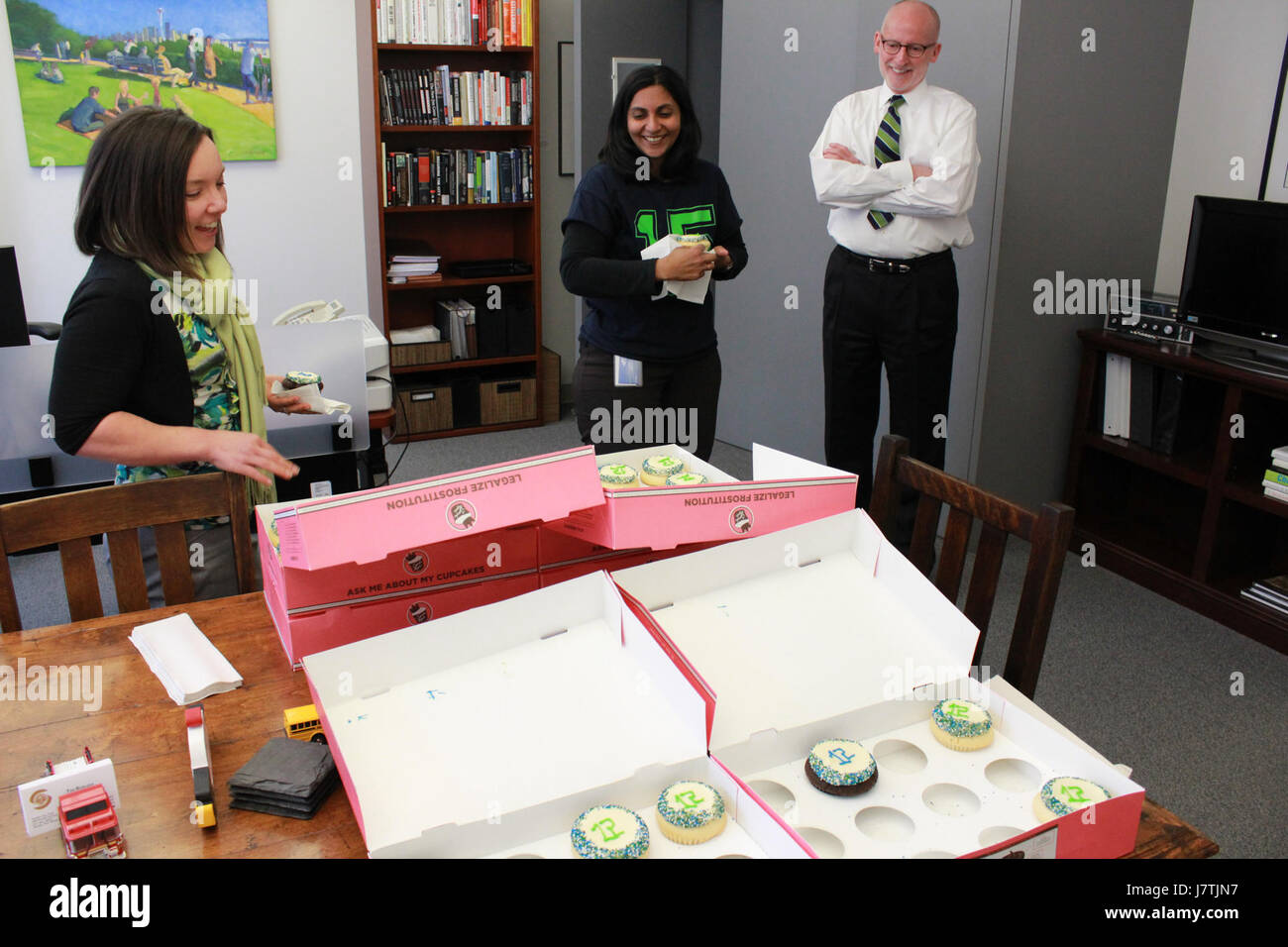 This image showcases a series of cupcakes designed with the theme of the '12th Man,' a reference to the fanbase of a sports team. The cupcakes are decorated to represent the passion and support of fans in a sports environment. Stock Photo