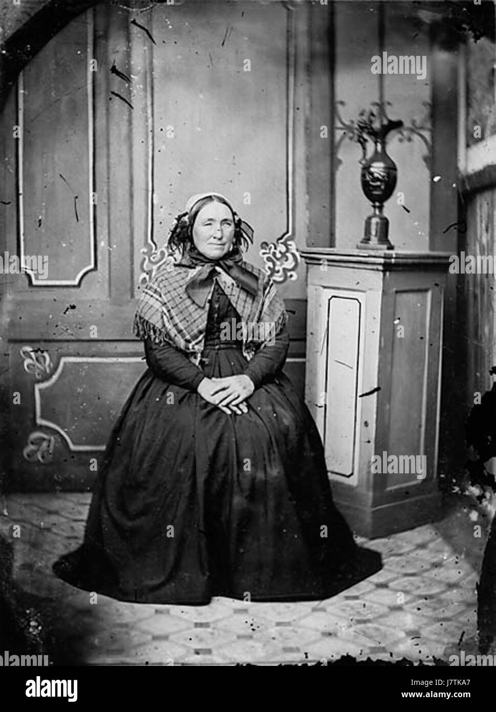 This image, identified as NLW3364753, depicts a woman seated, likely ...