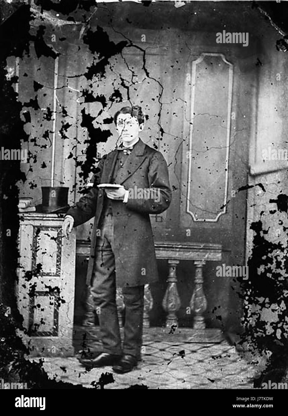 A young man standing and reading a book NLW3364690 Stock Photo - Alamy