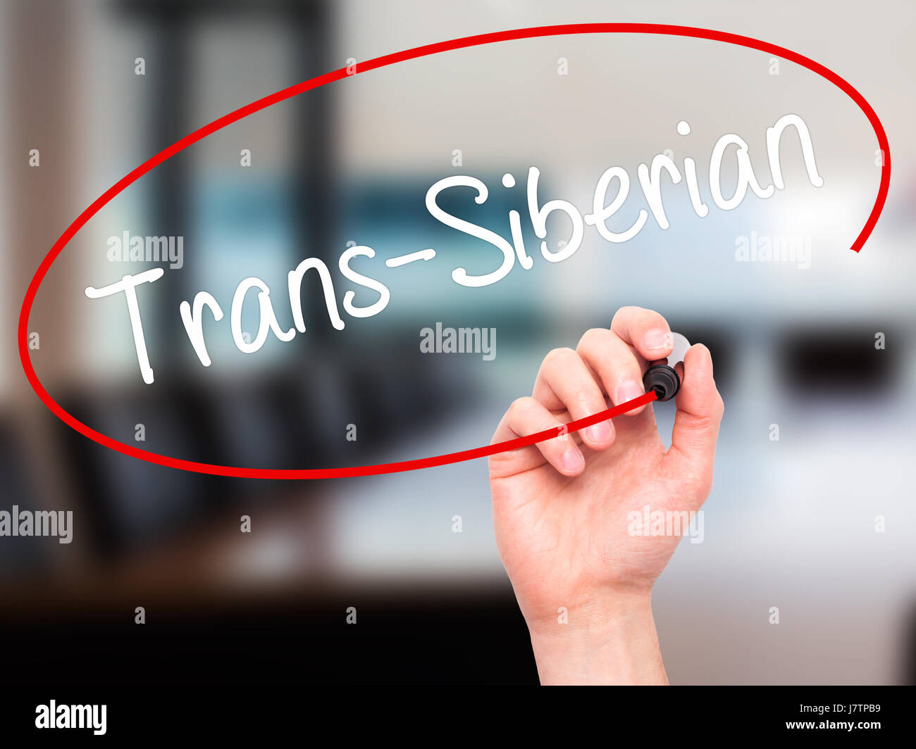 Man Hand writing Trans-Siberian with black marker on visual screen. Isolated on office. Business, technology, internet concept. Stock Photo Stock Photo