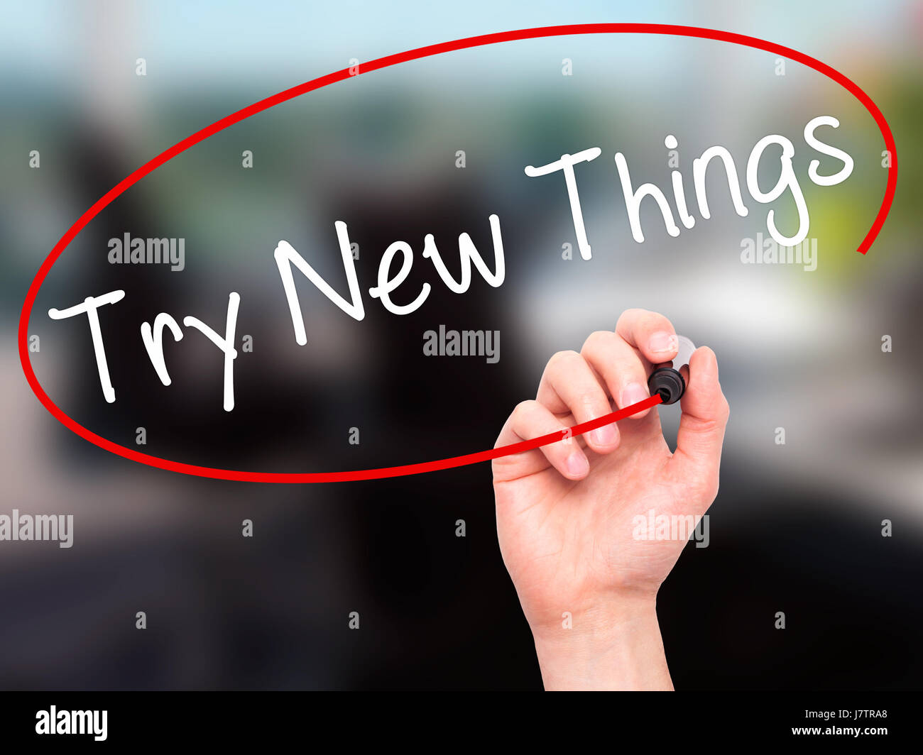 Writing Try Man Hand writing Try New Things with black marker on visual screen ...