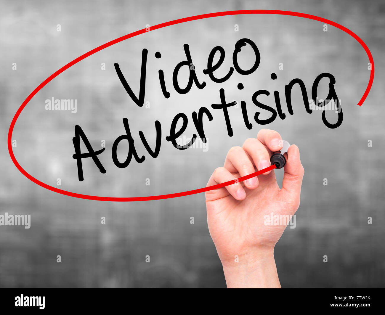 Man Hand writing Video Advertising with black marker on visual screen ...