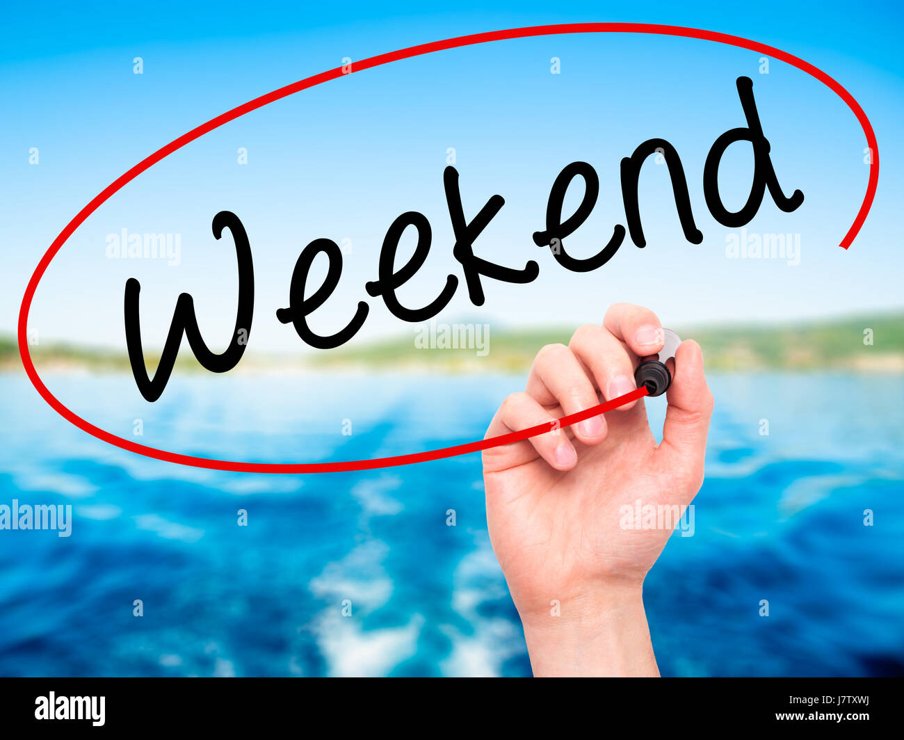 Weekend Hand Sign Man Hand writing Weekend with black marker on visual screen. Isolated ...