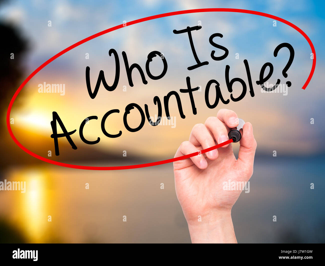 Man Hand writing Who Is Accountable? with black marker on visual screen ...