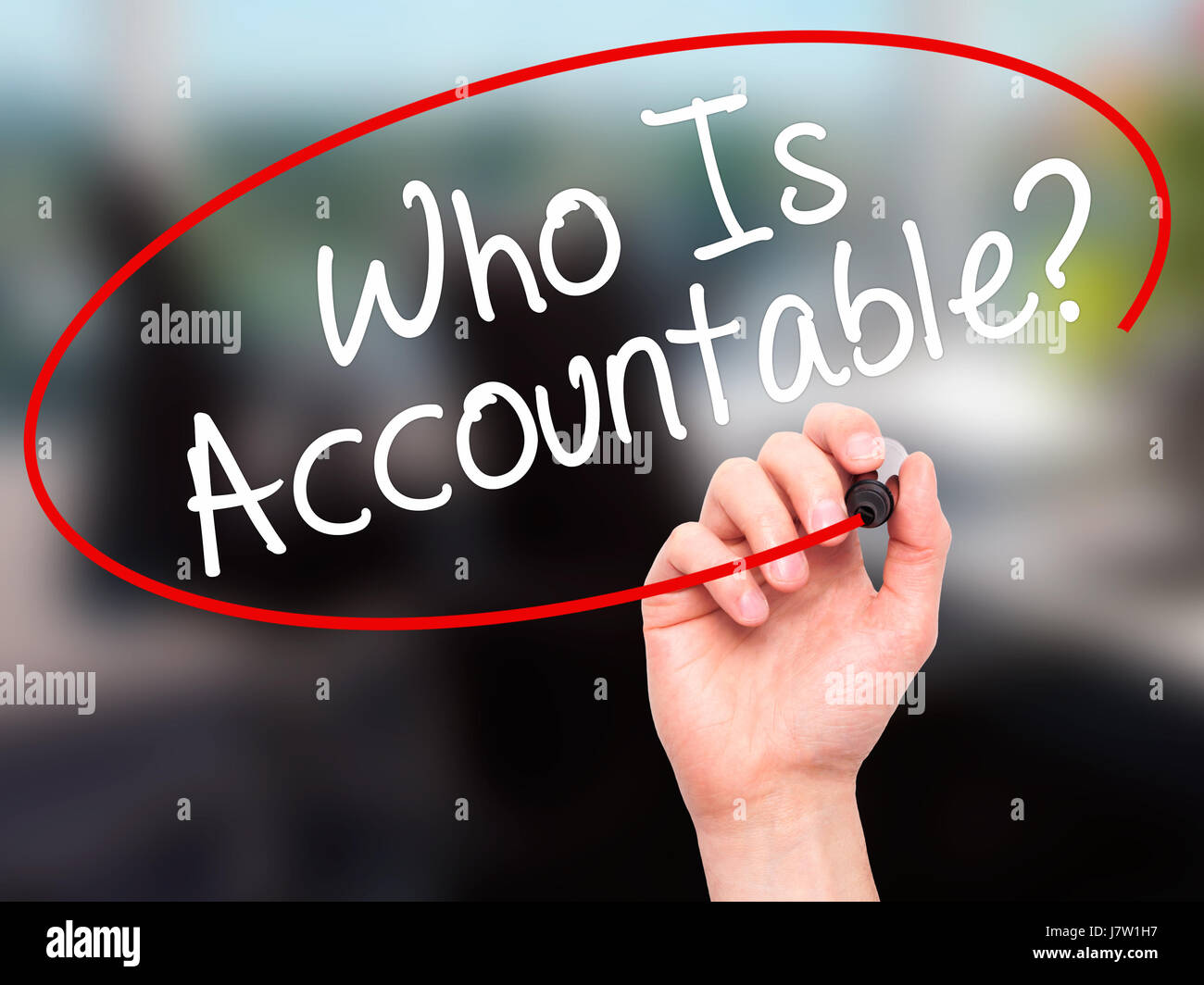 Man Hand writing Who Is Accountable? with black marker on visual screen ...
