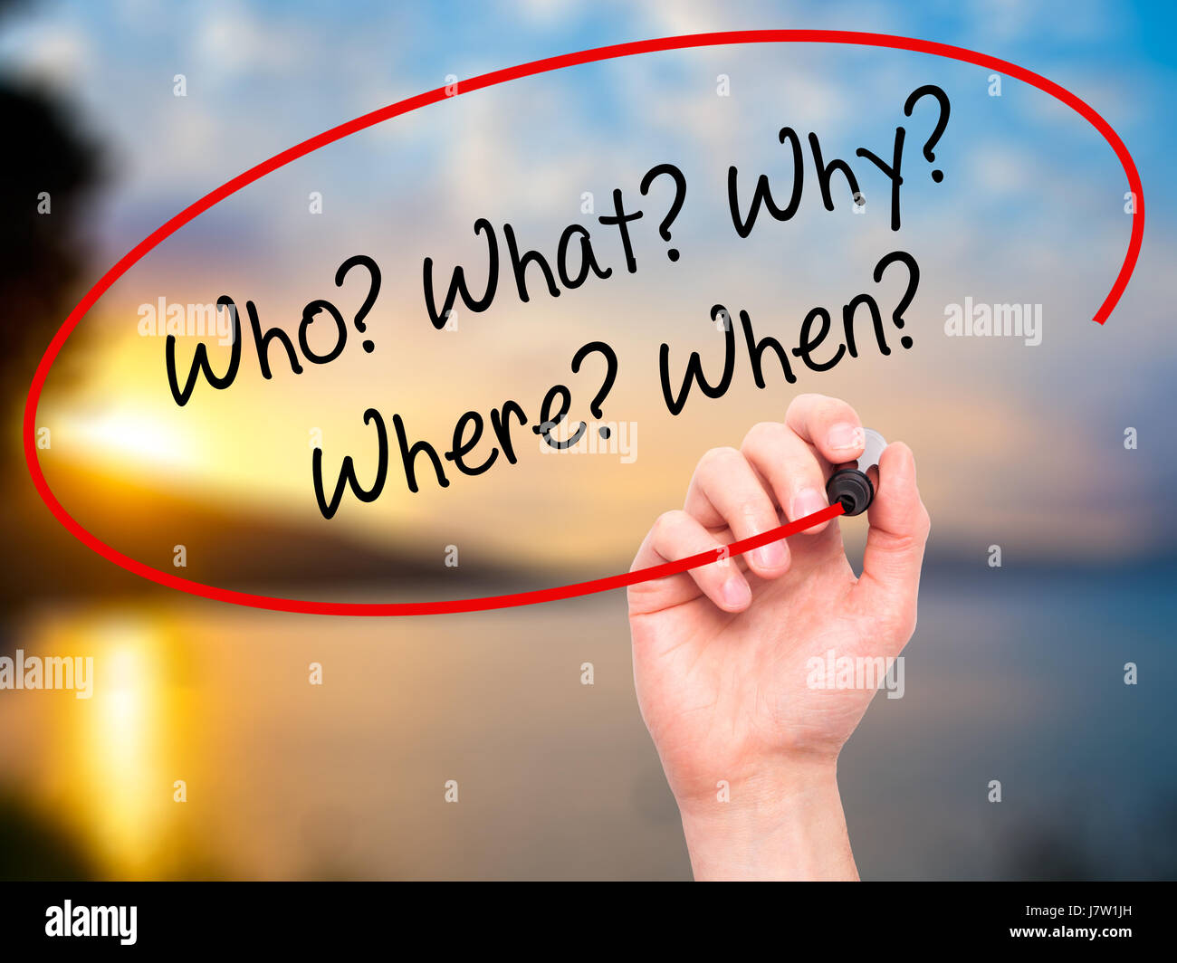 Man Hand writing Who? What? Why? Where? When? with black marker on ...