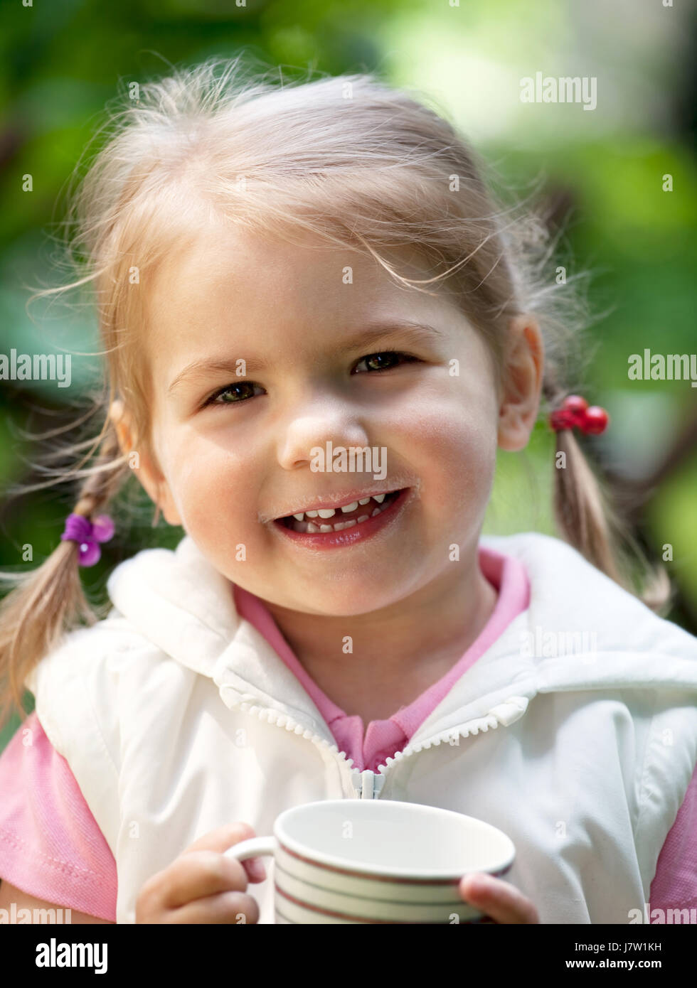 cup drink drinking bibs milk milksop girl girls toddler food breakfeast Stock Photo Alamy