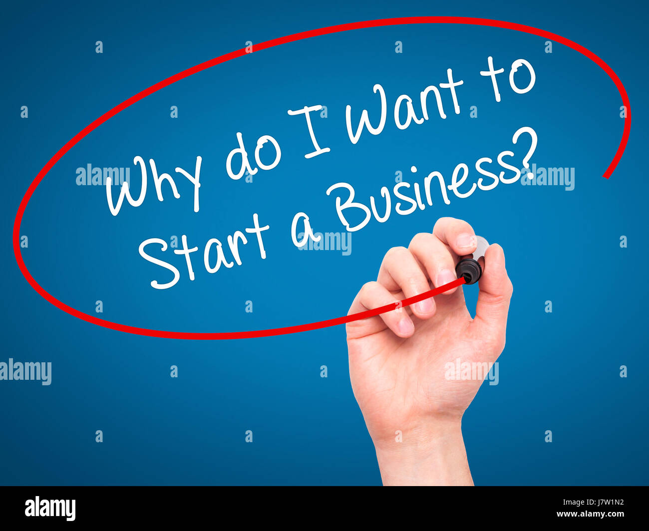 Man Hand writing Why do I Want to Start a Business? with black marker