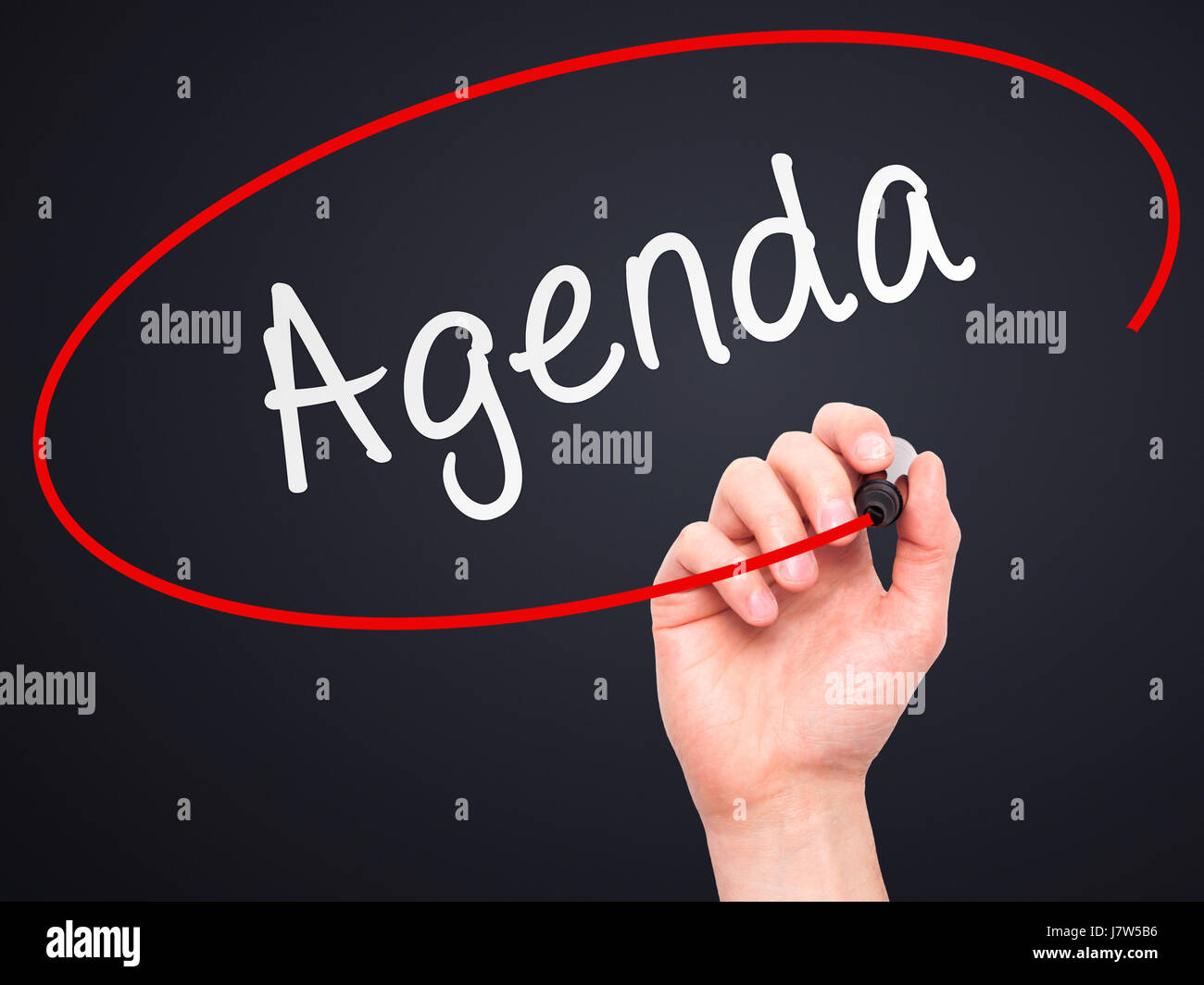 Man Hand writing Agenda with marker on transparent wipe board. Isolated ...