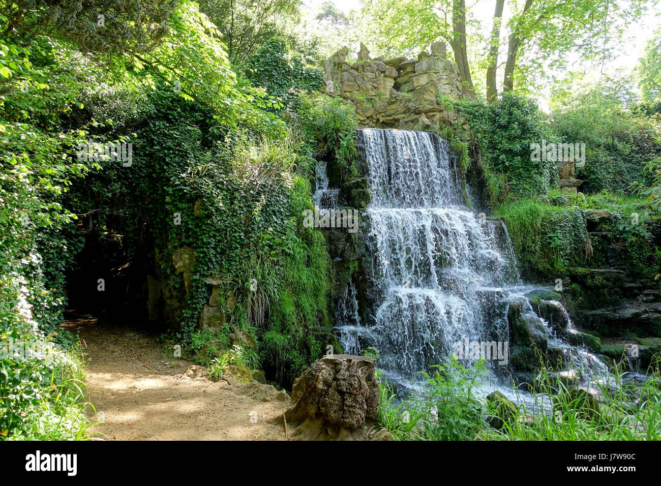 The Cascade at Bowood in Wiltshire, England, is a notable garden feature designed to enhance the natural beauty of the estate. The cascading water provides both aesthetic and hydrological value, contributing to the landscape design. Stock Photo