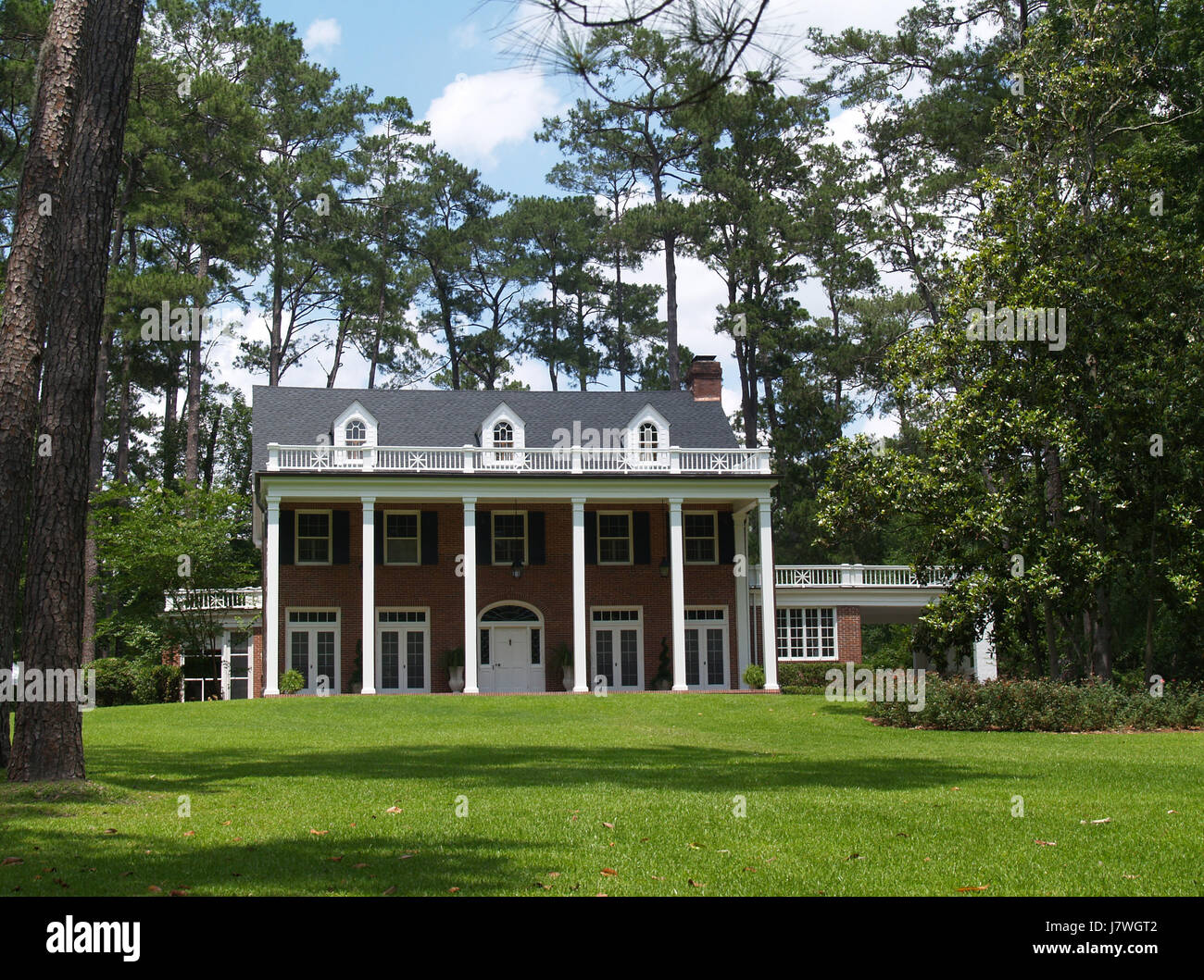 house building historical columns brick real estate exterior home