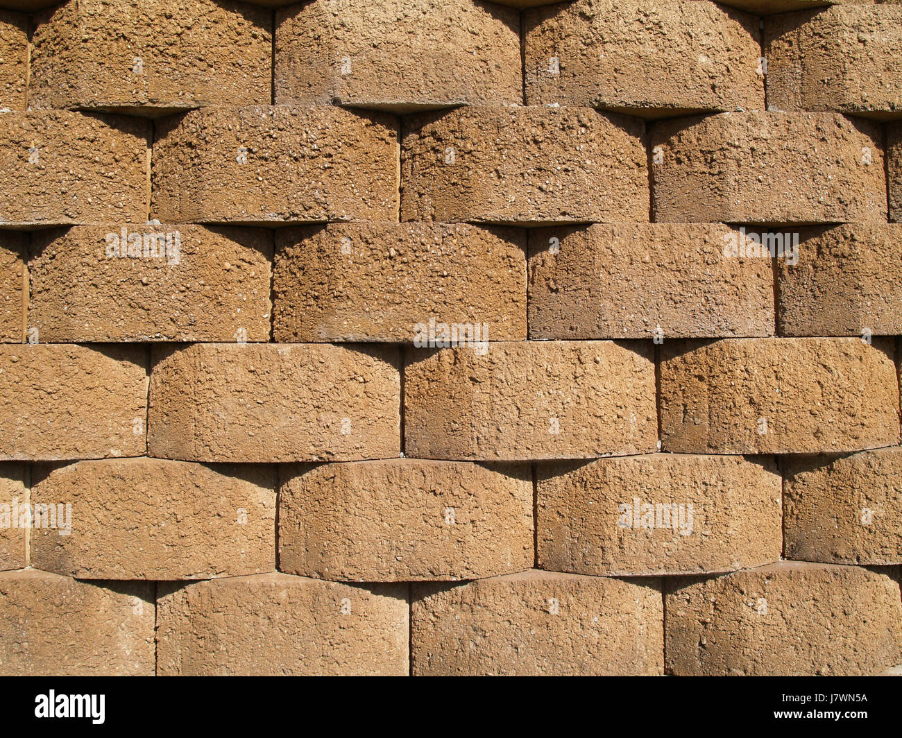 wall basket weave brick tan backdrop background texture stone rough rock Stock Photo
