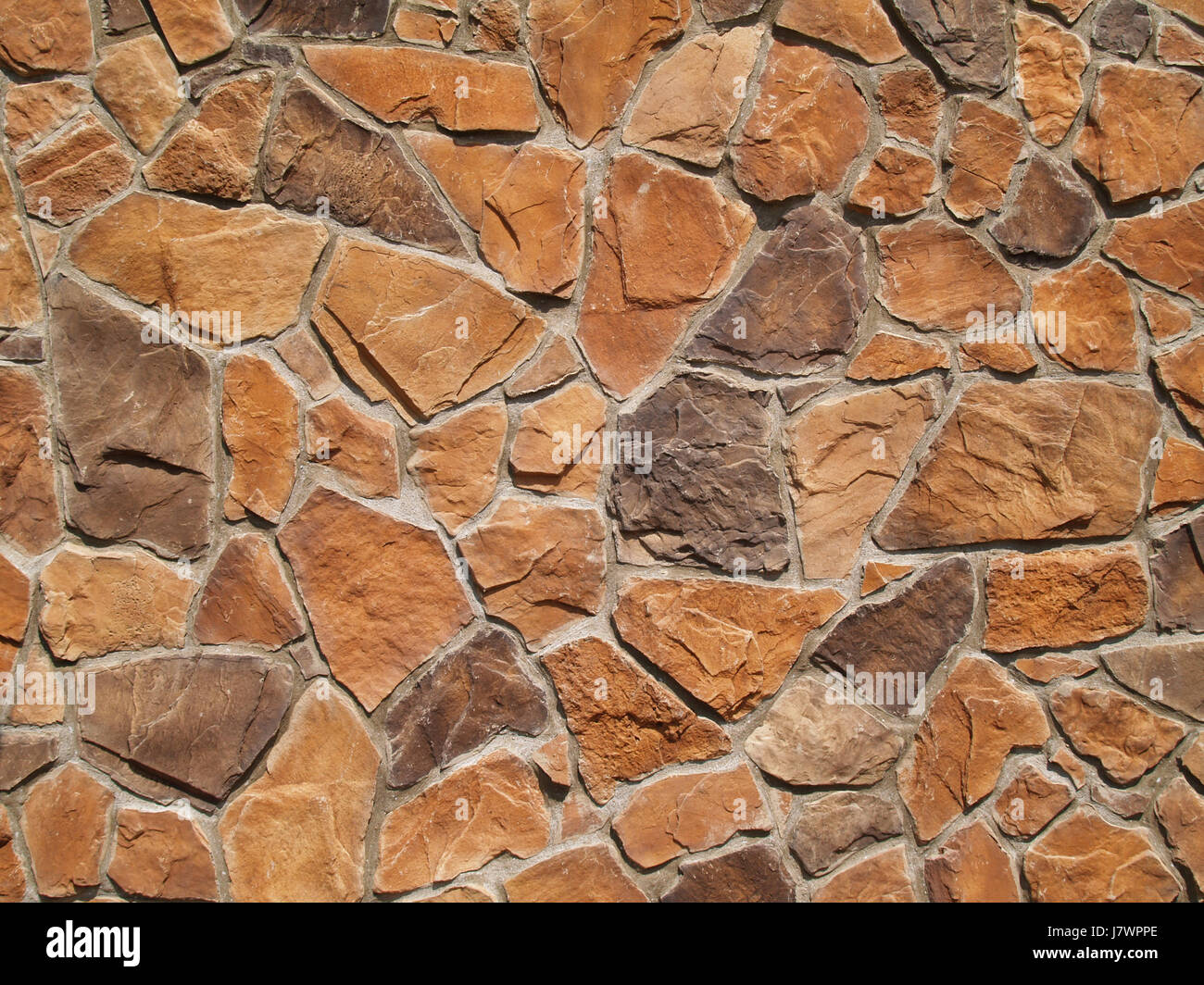 stone brown brownish brunette rock wall style of construction architecture Stock Photo