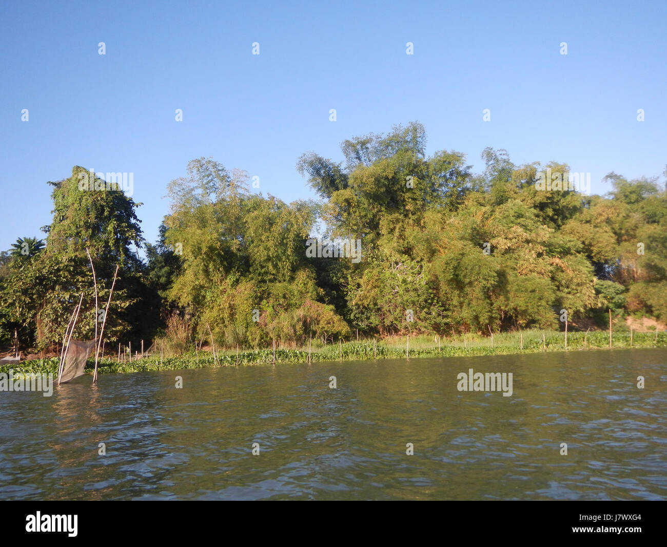 This project in Pulilan, Bulacan, involves the construction of riprap along riverbanks to protect trees and surrounding areas from erosion. It emphasizes environmental protection and flood mitigation along the local river system. Stock Photo