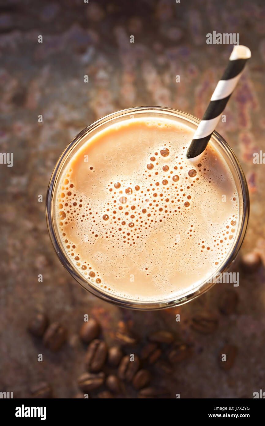 Iced coffee with black and white striped straw Stock Photo Alamy