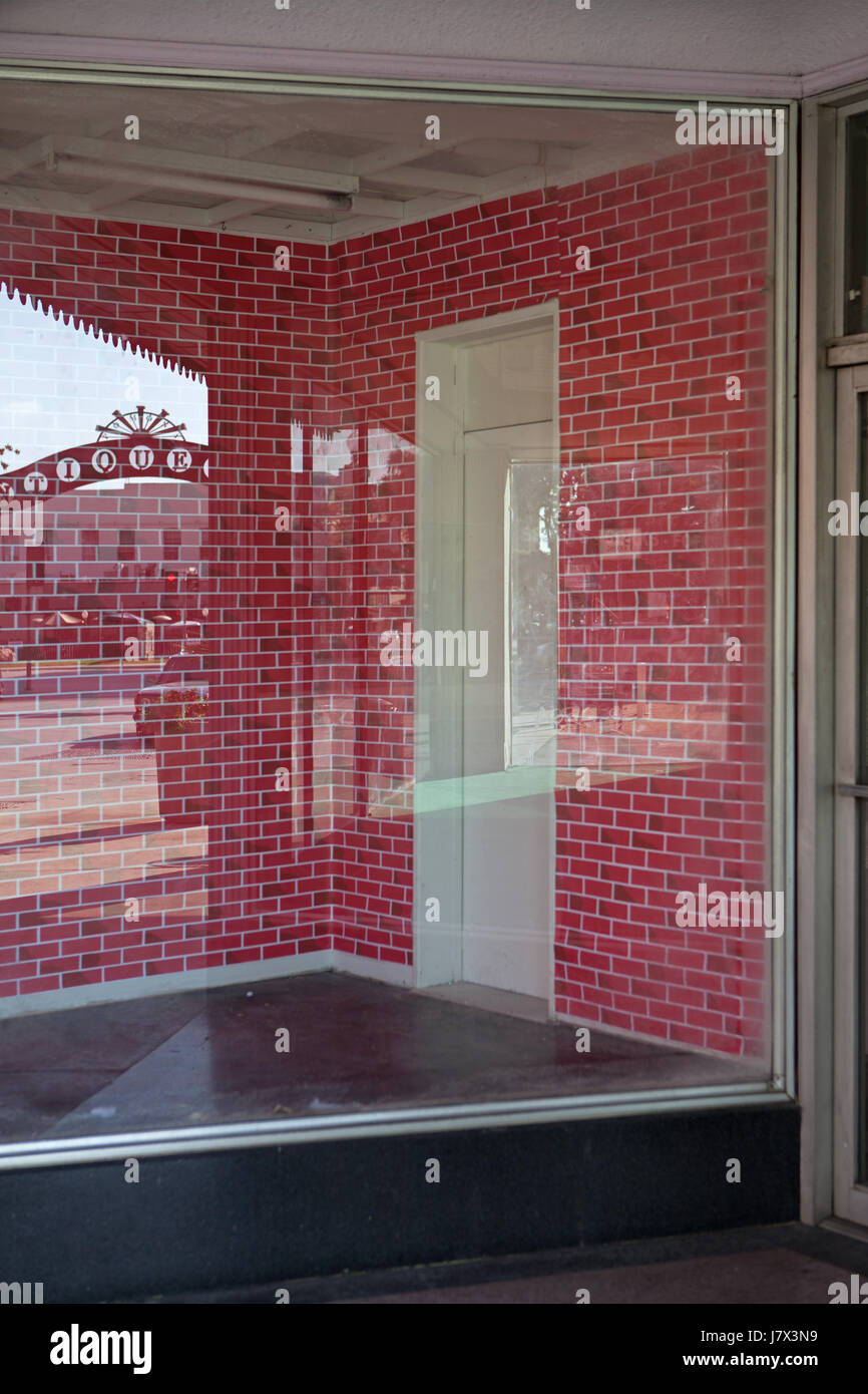 Empty store window in Pomona, CA Stock Photo