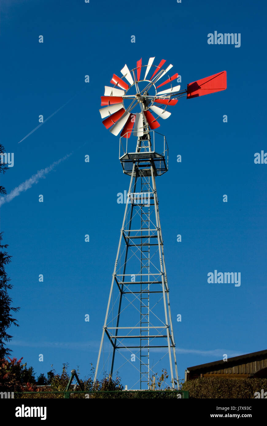 classic windmill with red and white wings Stock Photo