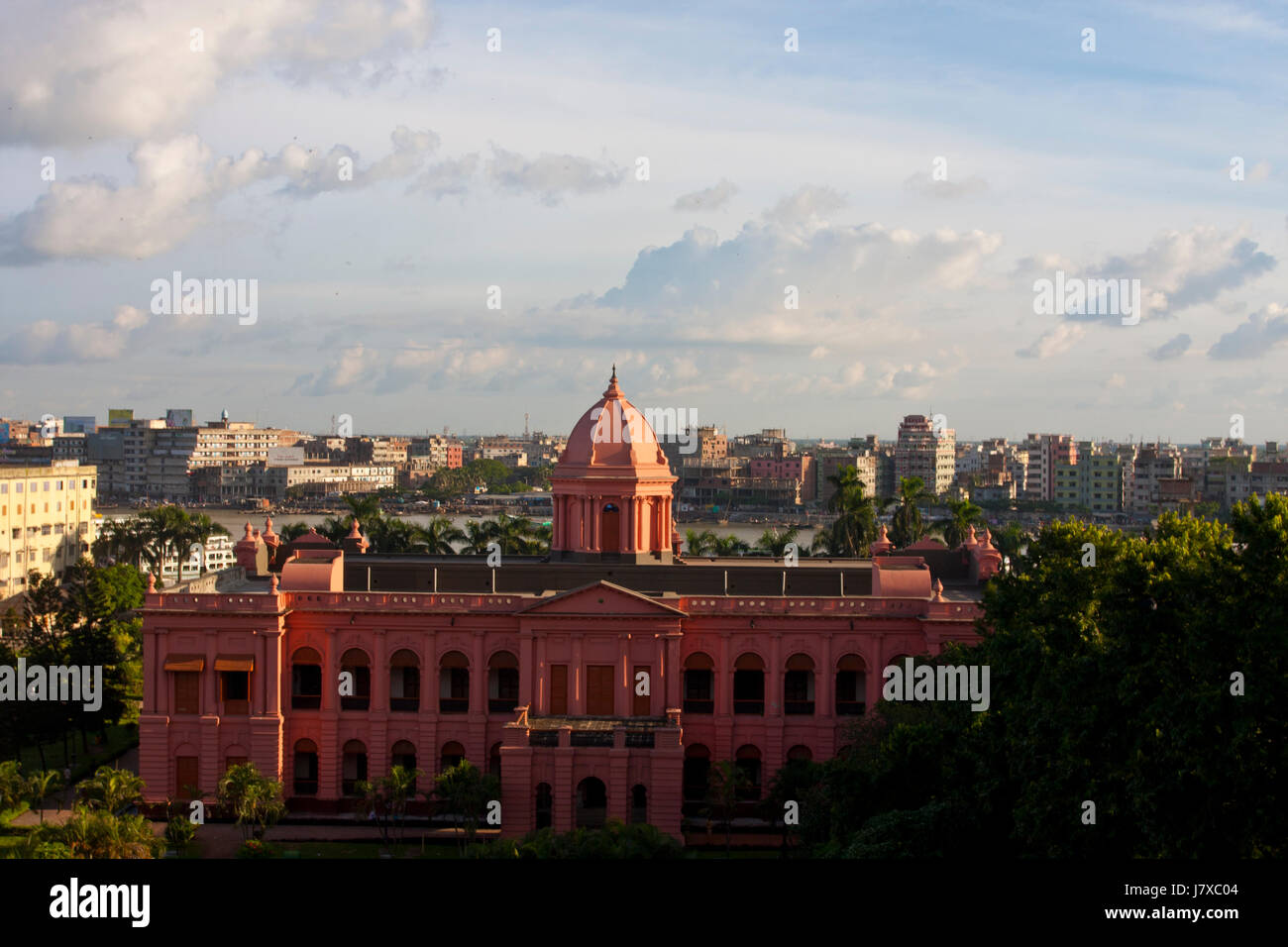 The historic Ahsan Manjil, is situated in Kumartoli, on the bank of the Buriganga river, in Dhaka, Bangladesh. It had been used as the residential pal Stock Photo