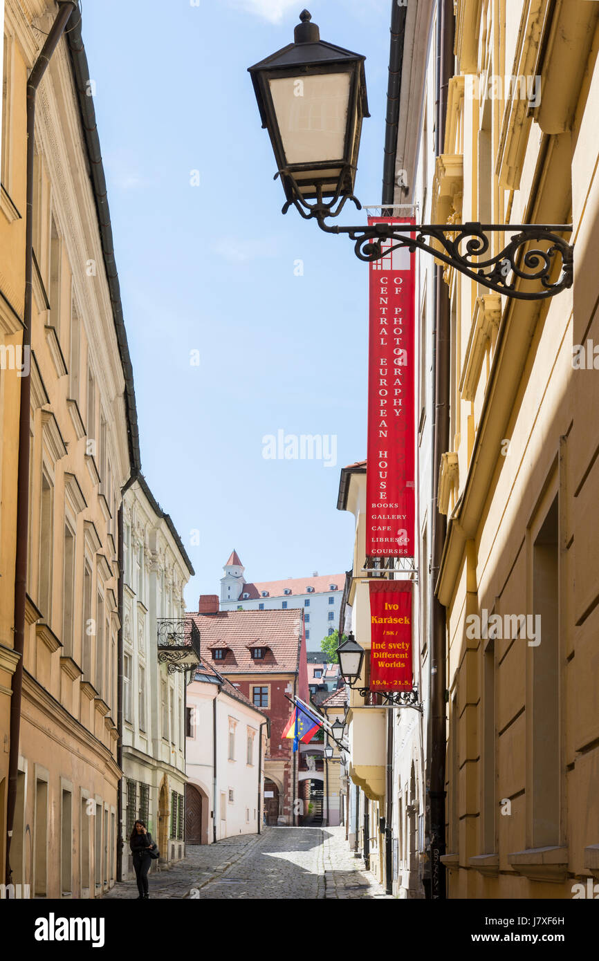 The street in the center of the city with the castle in the background in Bratislava Stock Photo