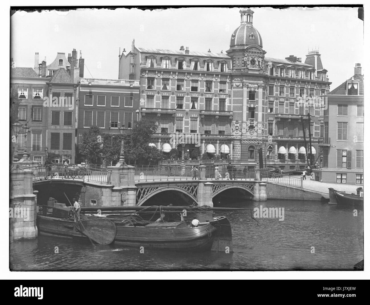 Binnenamstel is a river in the Netherlands, depicted in this photograph by Jacob Olie. The image captures the river's serene beauty, highlighting the natural landscape and water flow, as well as the surrounding environment. The photograph showcases a peaceful and picturesque view of this Dutch waterway. Stock Photo