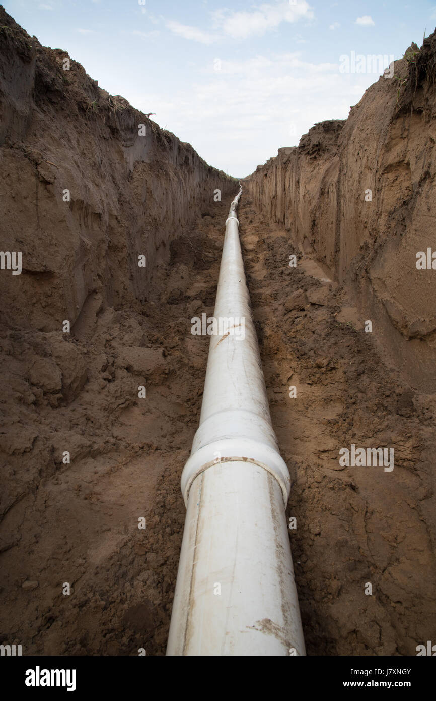 Irrigation pipe sitting in trench during installation Stock Photo Alamy