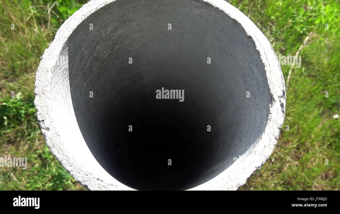 cement pipe sticking out of the ground Stock Photo Alamy