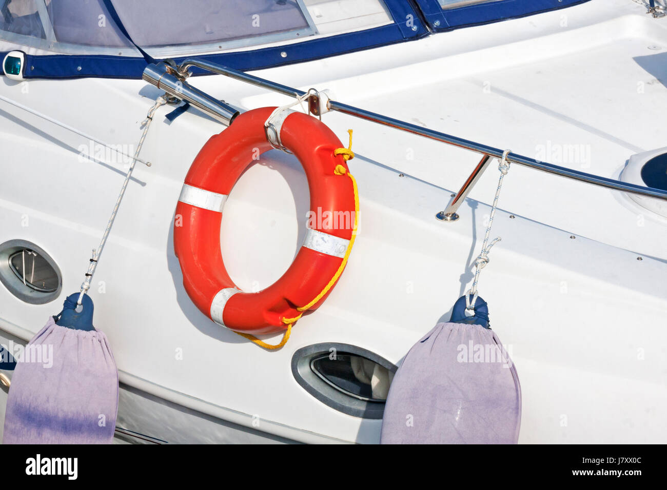 Lifeline on white fiberglass sailboat Stock Photo Alamy