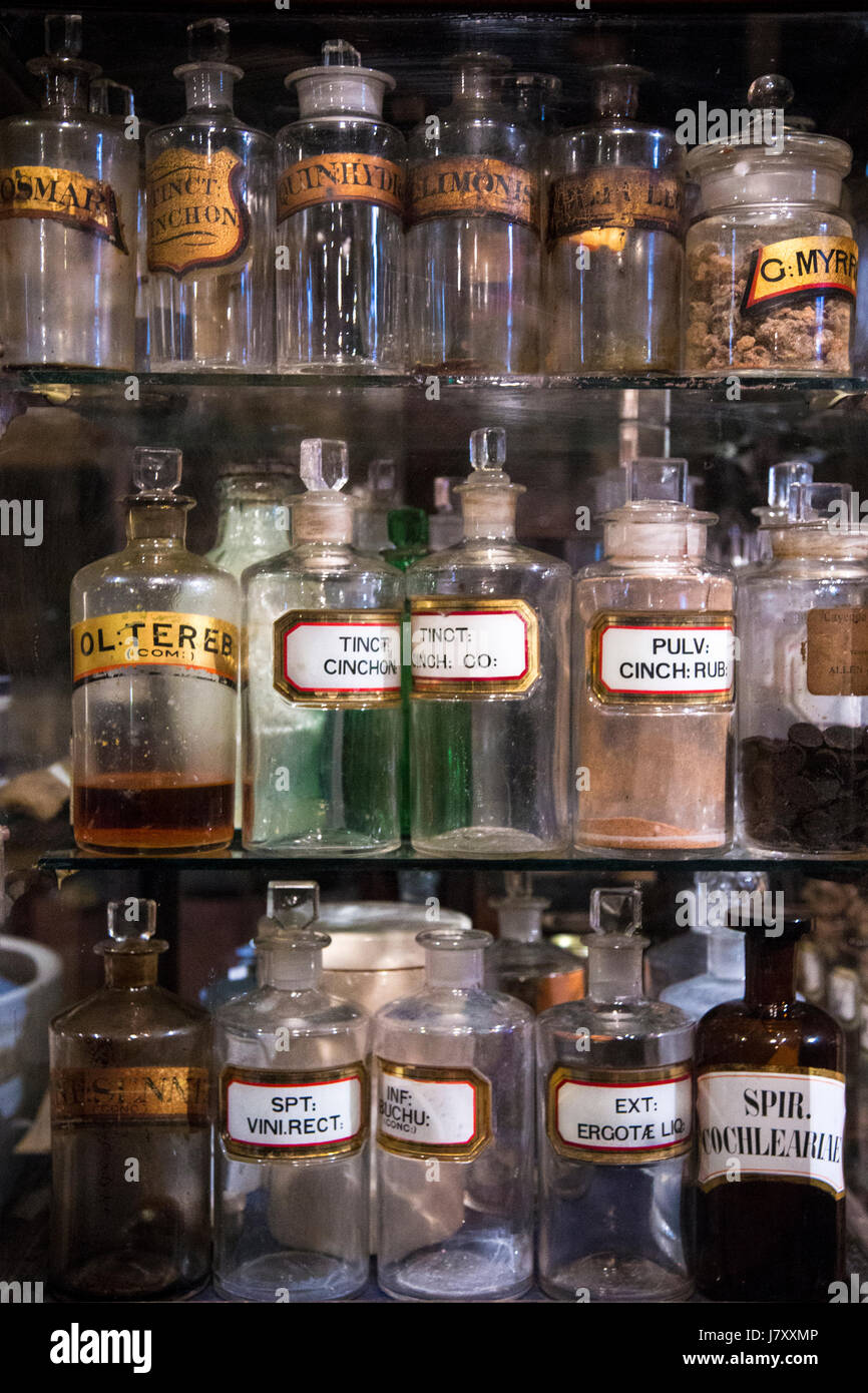 Traditional victorian apothecary's, cabinet with tinctures, medicine and potions (Old Operating Theatre Museum and Herb Garret, London, UK Stock Photo