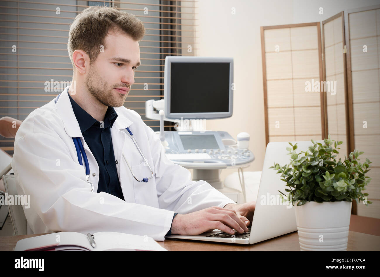 Doctor Gynecologist Working In Office Ultrasound In Background