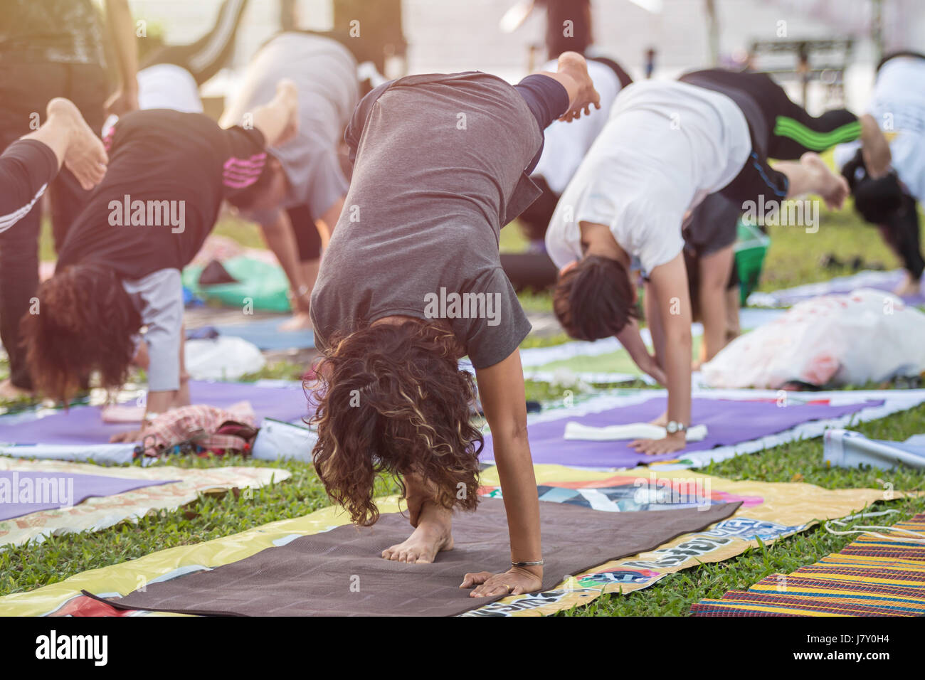 Group of asian woman doing yoga or exercise in the park Stock Photo - Alamy