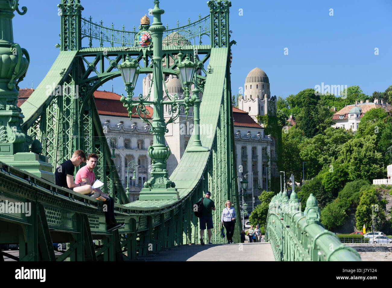 Hungary, Budapest. The Liberty Bridge. Students sitting on the bridge Stock Photo