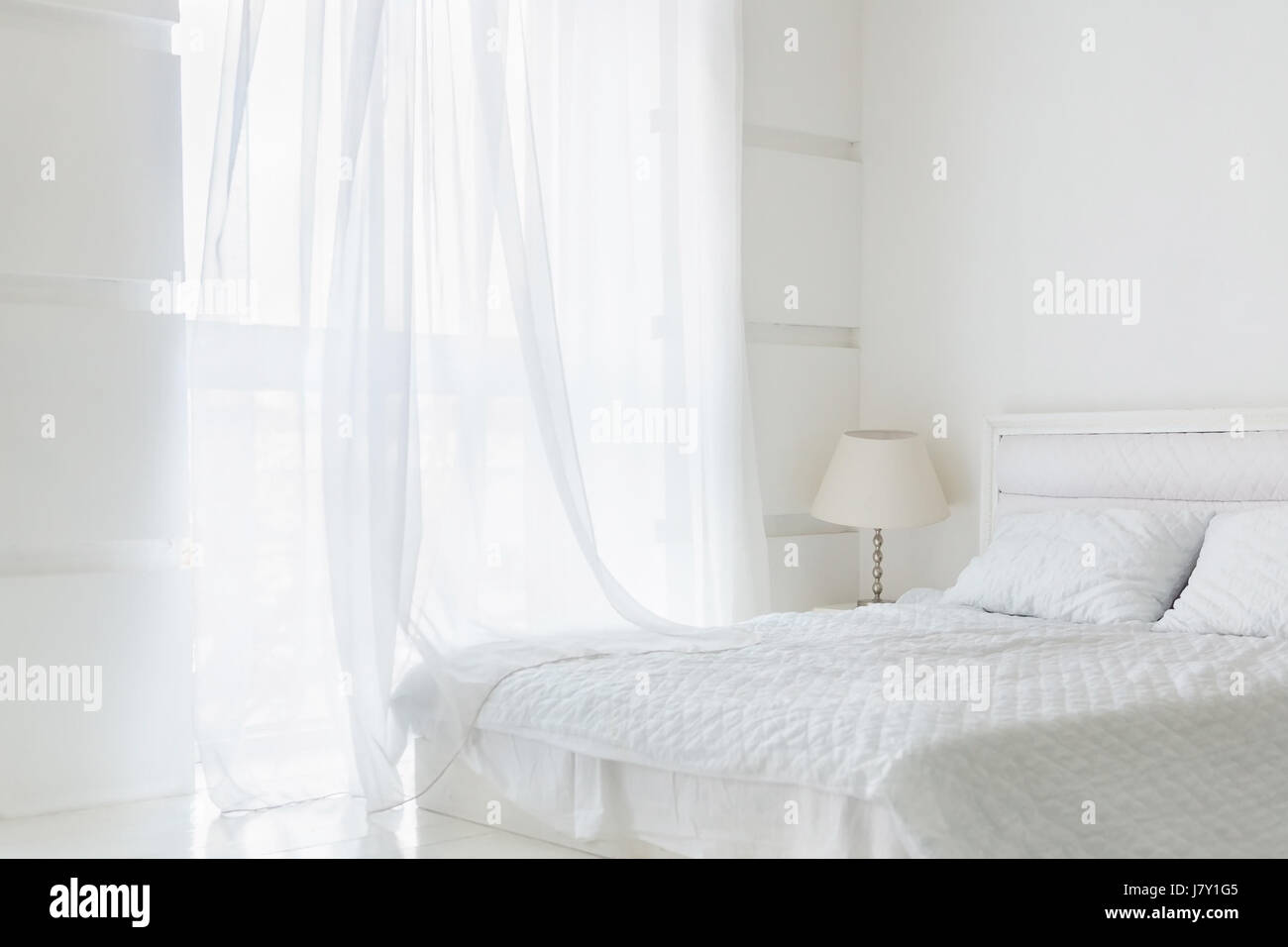 Clean white bedroom interior Stock Photo Alamy