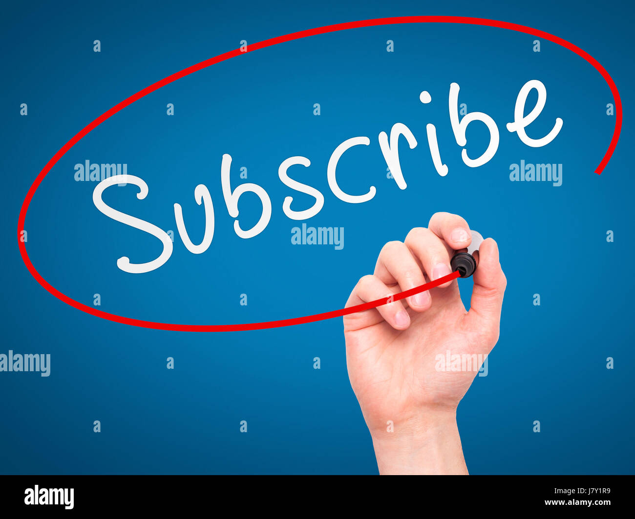 Man Hand writing Subscribe with marker on transparent wipe board ...