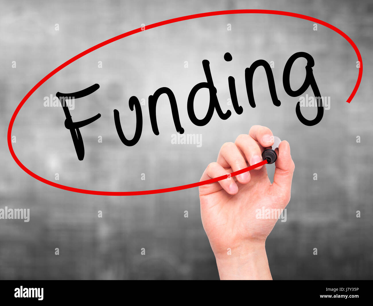 Signing Funded Man Hand writing Funding with marker on transparent wipe board ...