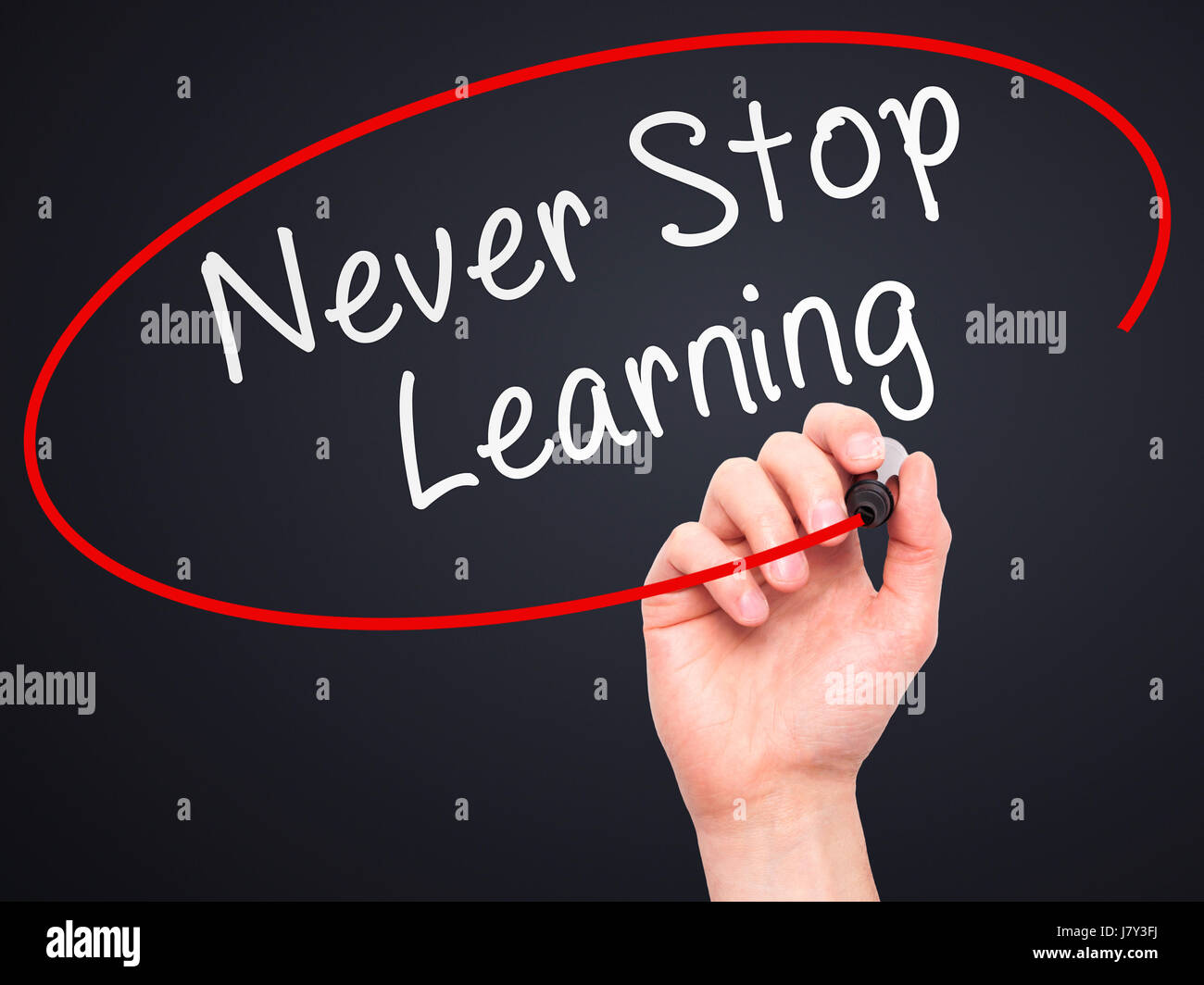 Man hand writing Never Stop Learning on visual screen. Business,help ...