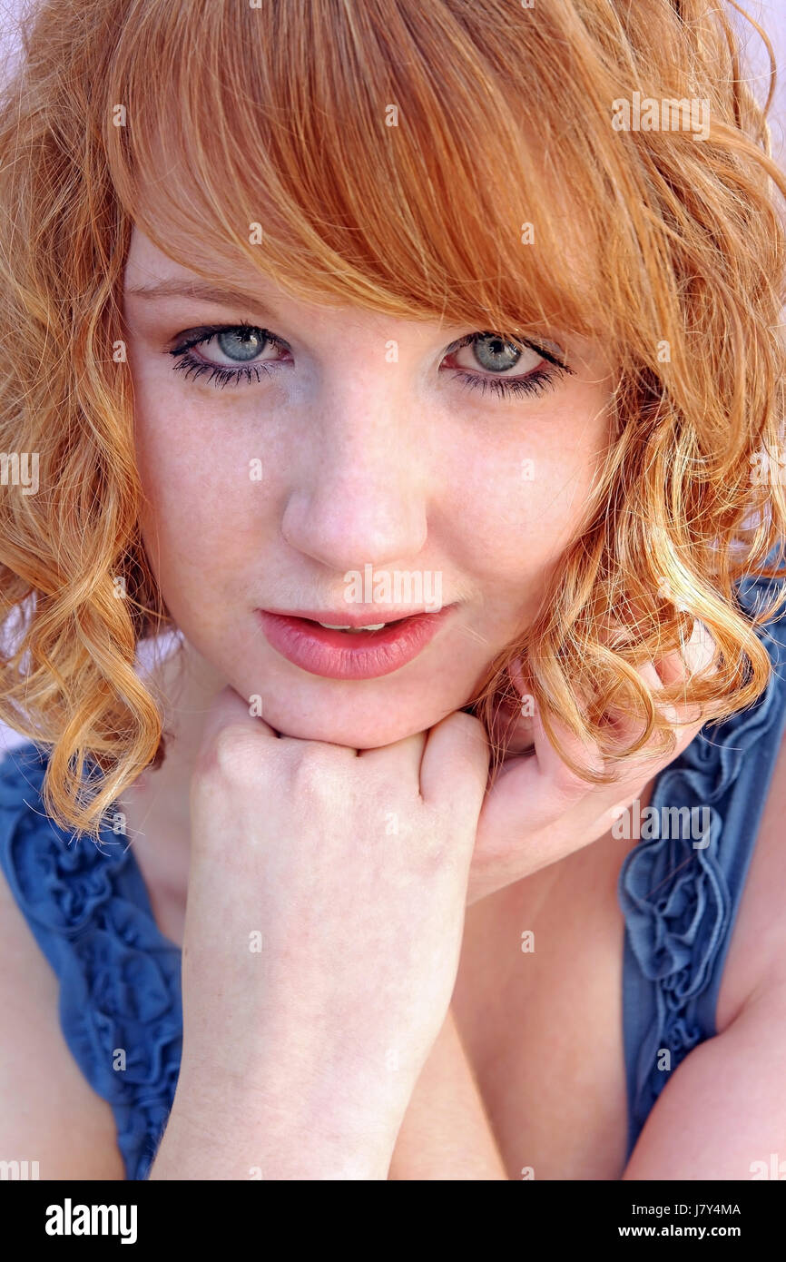 young red-haired girl with freckles Stock Photo