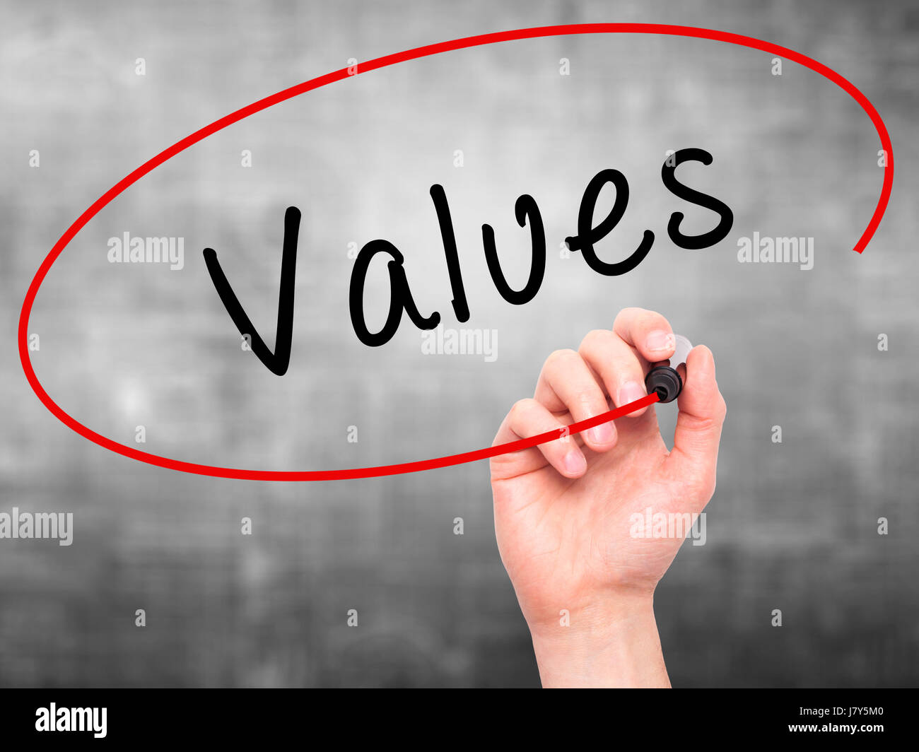 Hand Writing Values Man Hand writing Values with black marker on visual screen. Isolated on ...