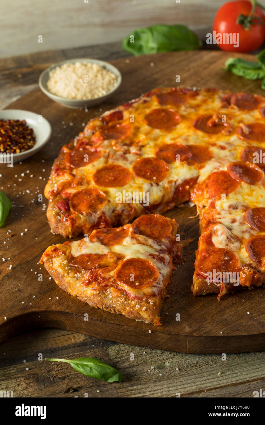 Homemade Pepperoni Pretzel Crust PIzza with Salt and Cheese Stock Photo