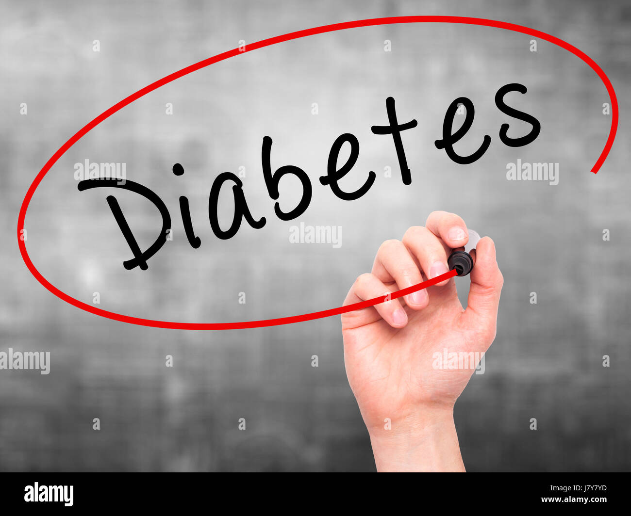 Man Hand writing Diabetes with marker on transparent wipe board ...