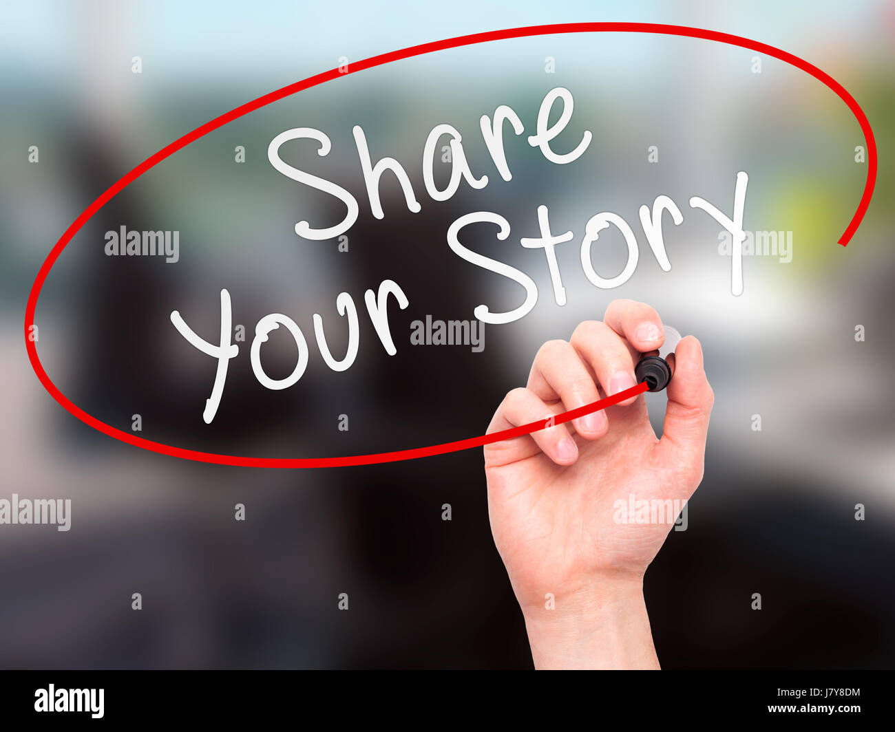 Man Hand writing Share Your Story with marker on transparent wipe board ...