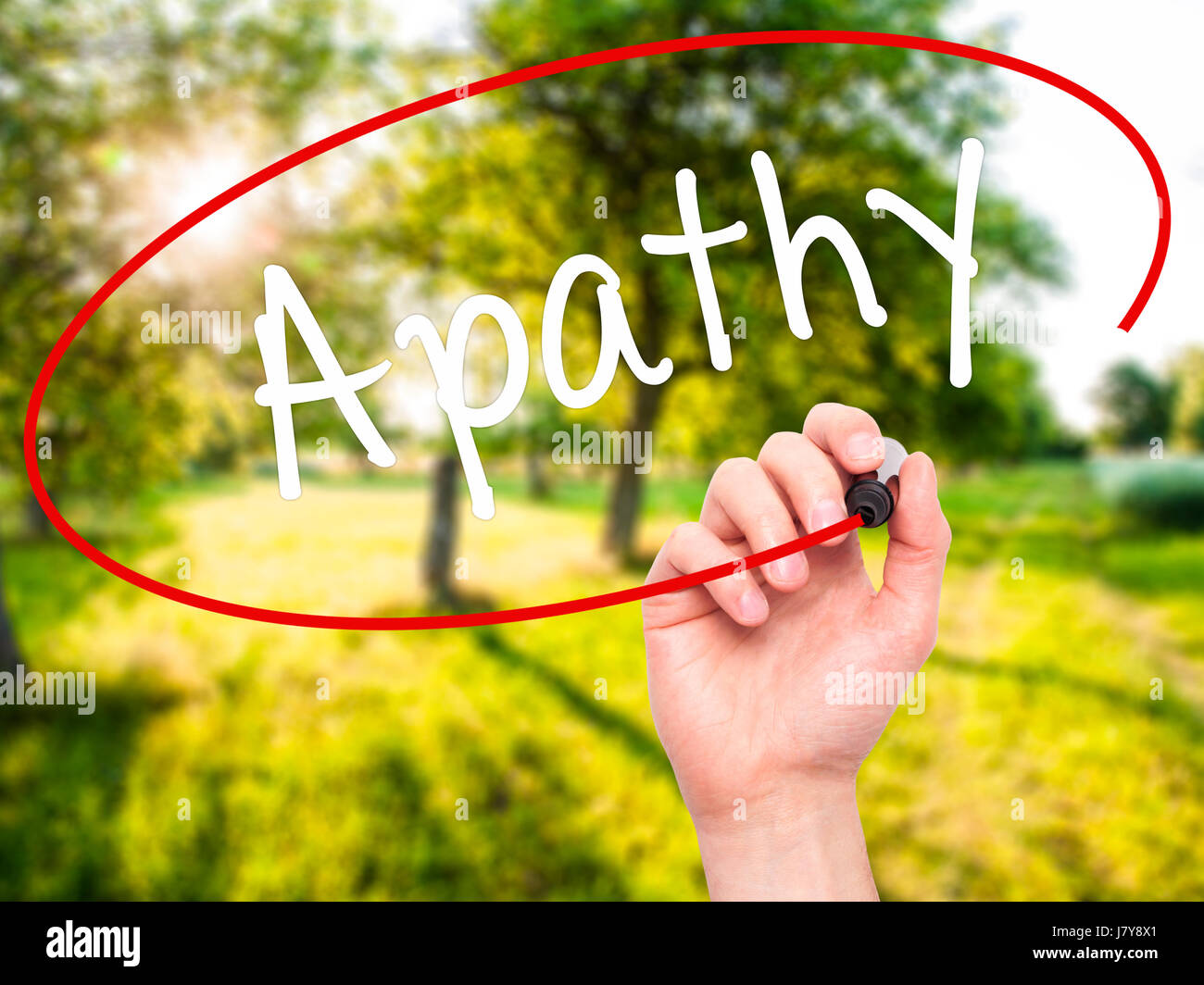 Man Hand writing Apathy with black marker on visual screen. Isolated on ...
