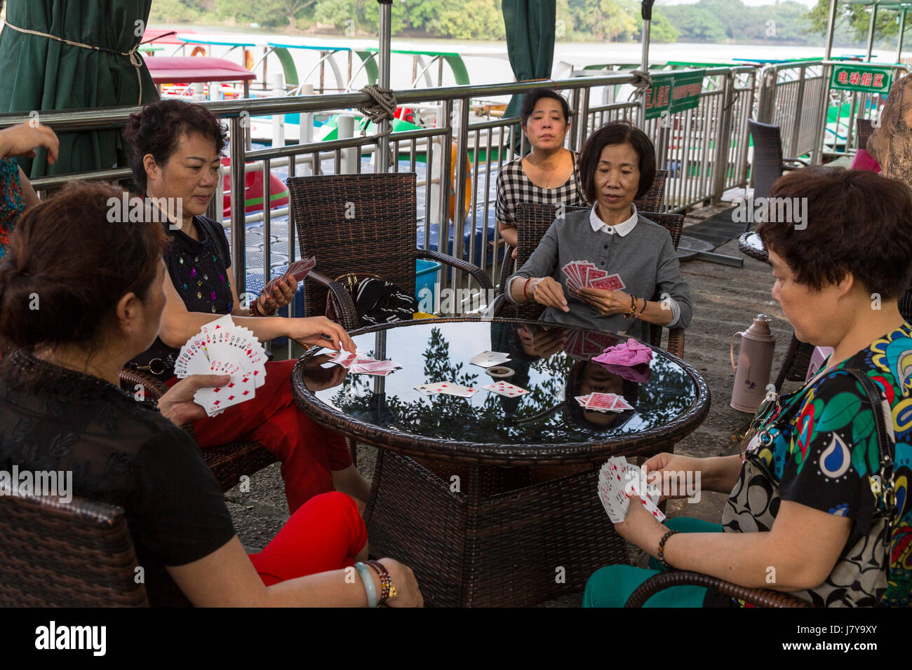 Wenzhou, Zhejiang, China.  Jiangxin Island, Women Playing Cards. Stock Photo
